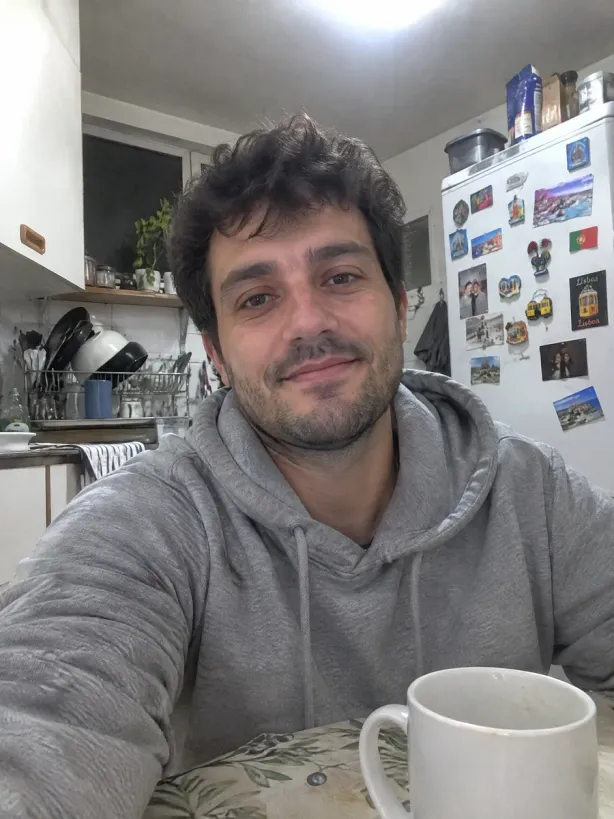 Generated amateur selfie of a man in a kitchen